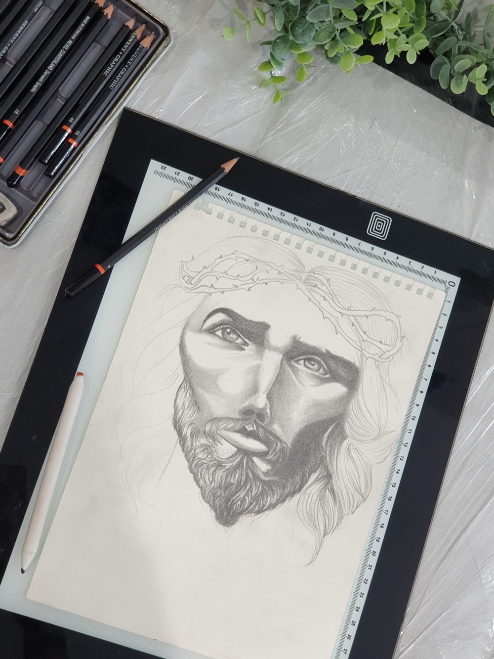 Original pencil sketch of a face, drawn by the artist as part of the custom design process